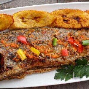 Freshly Prepared Grilled Fish with Plantain and Pepper Sauce